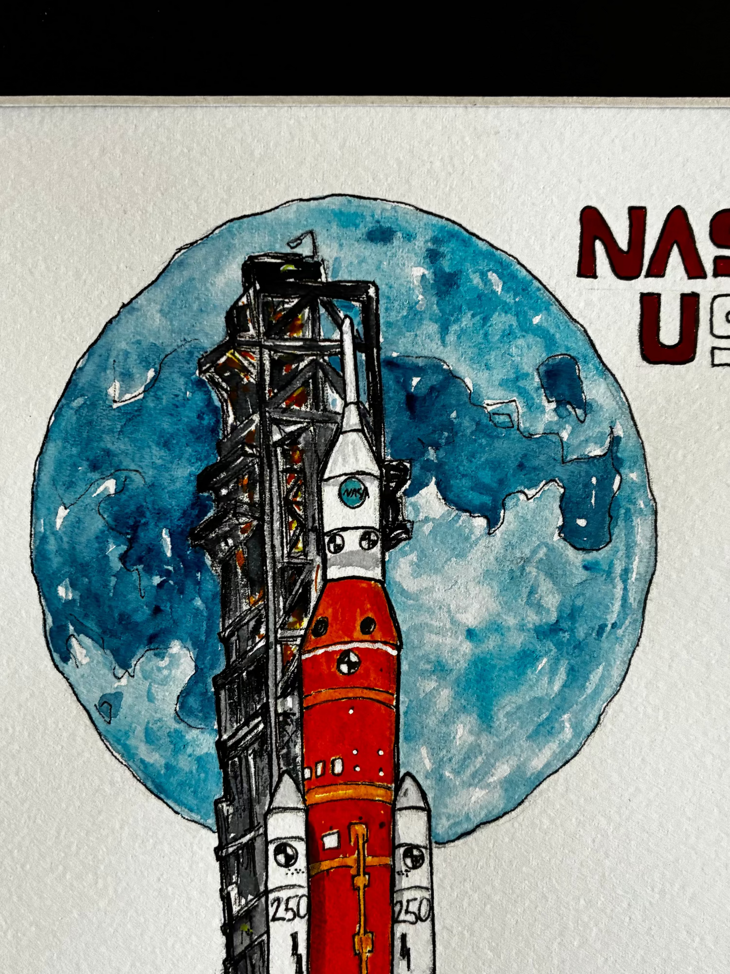 Illustration of a rocket with a moon background and 'NASA' text.