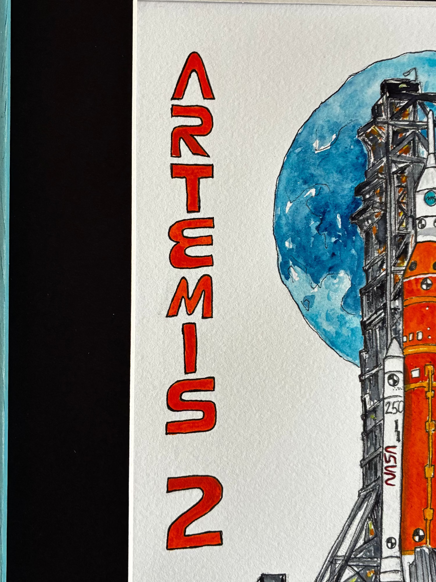 Artistic depiction of a rocket with 'Artemis 2' text against a moonlit sky.