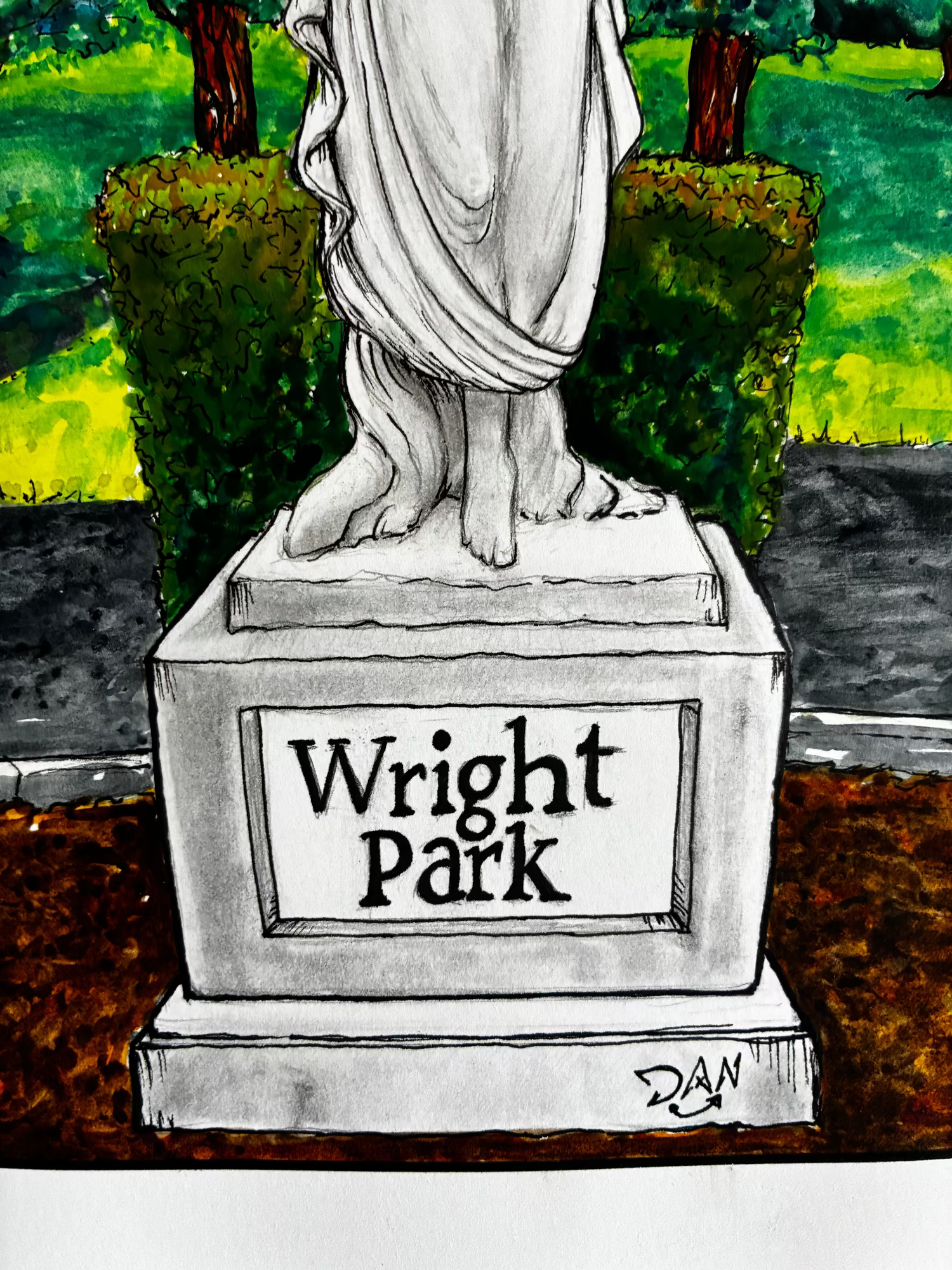 Statue with 'Wright Park' sign in a garden setting