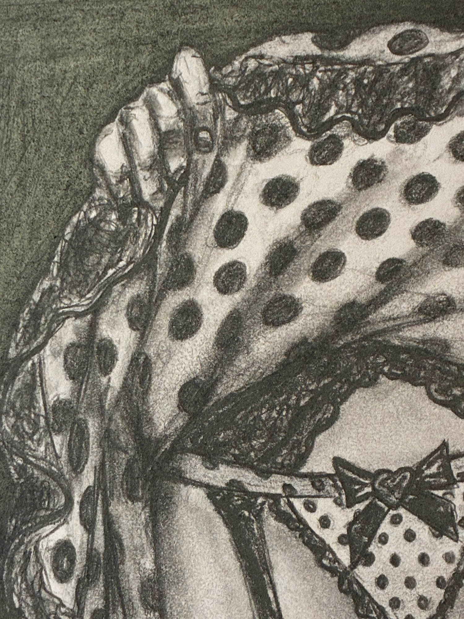 Close-up of a polka dot fabric with lace trim