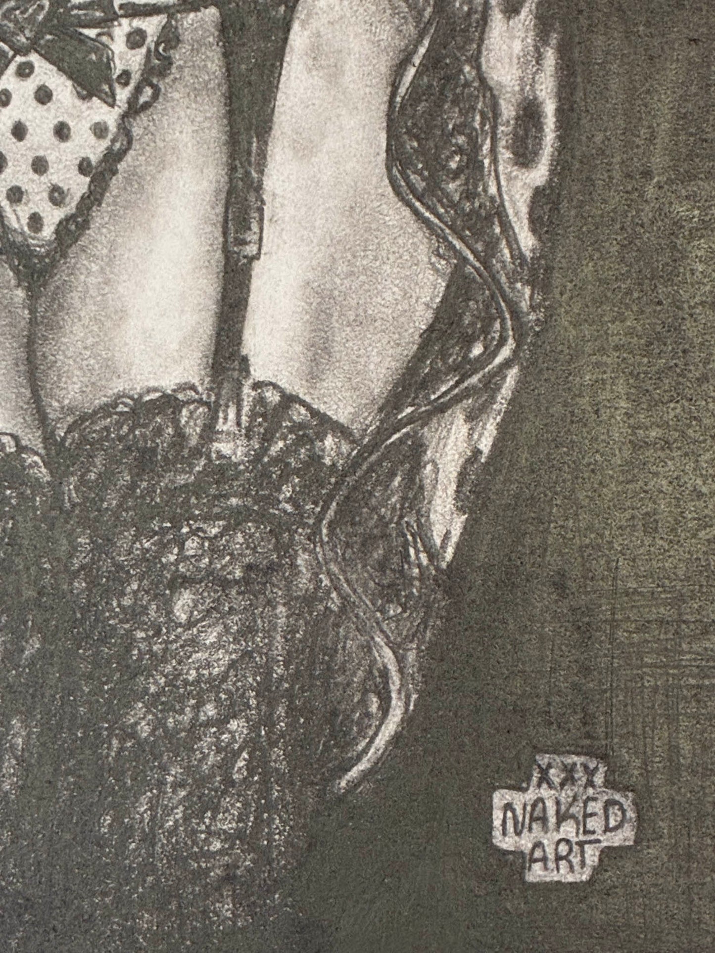 Black and white illustration of a woman's legs with 'Naked Art' label.