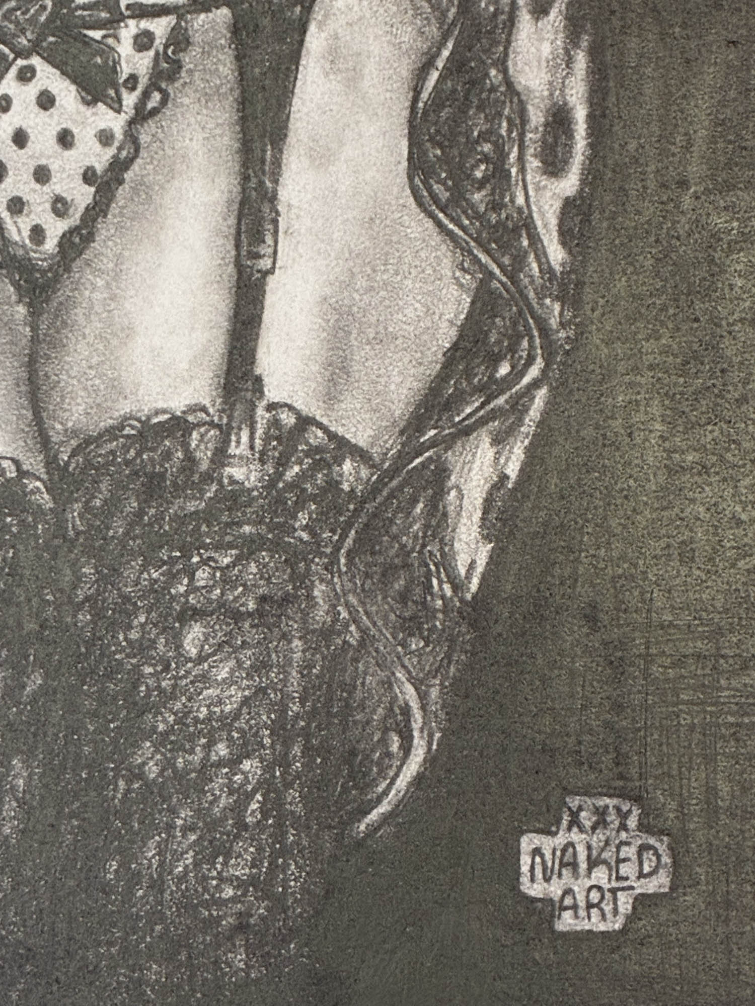 Black and white illustration of a woman's legs with 'Naked Art' label.