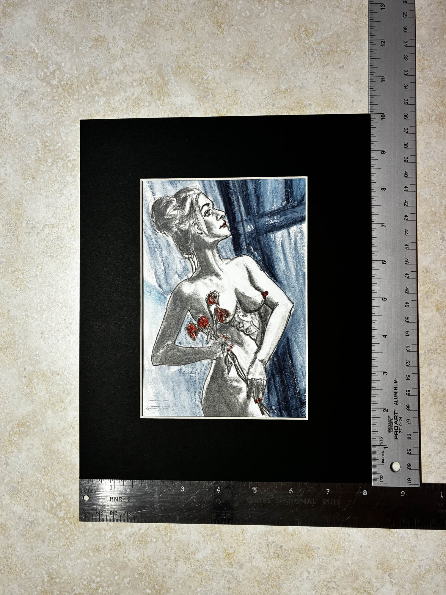 Artistic depiction of a woman holding roses in a black frame with a ruler for scale.