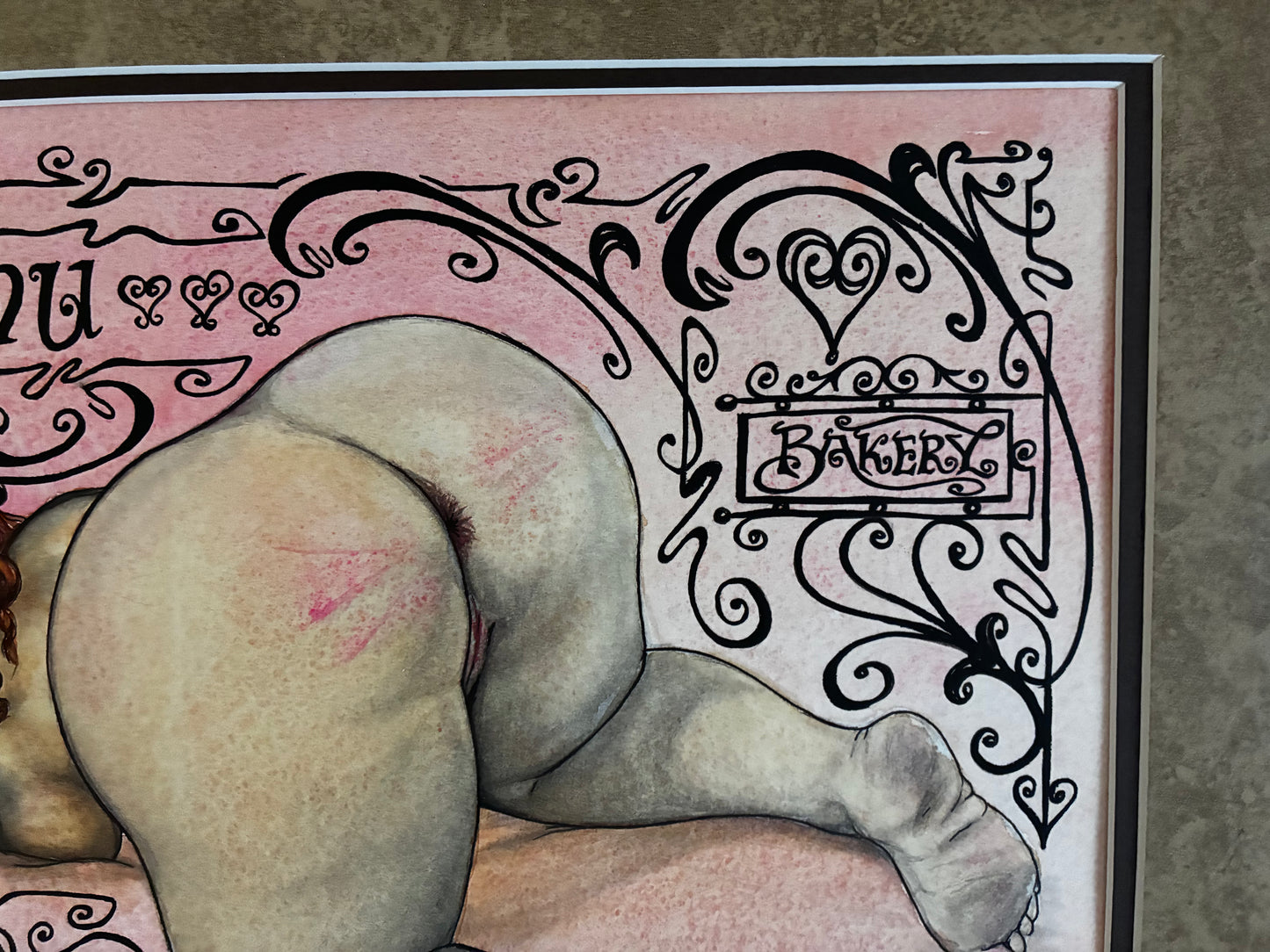 Illustration of a person's buttocks with decorative text and design elements on a pink background.