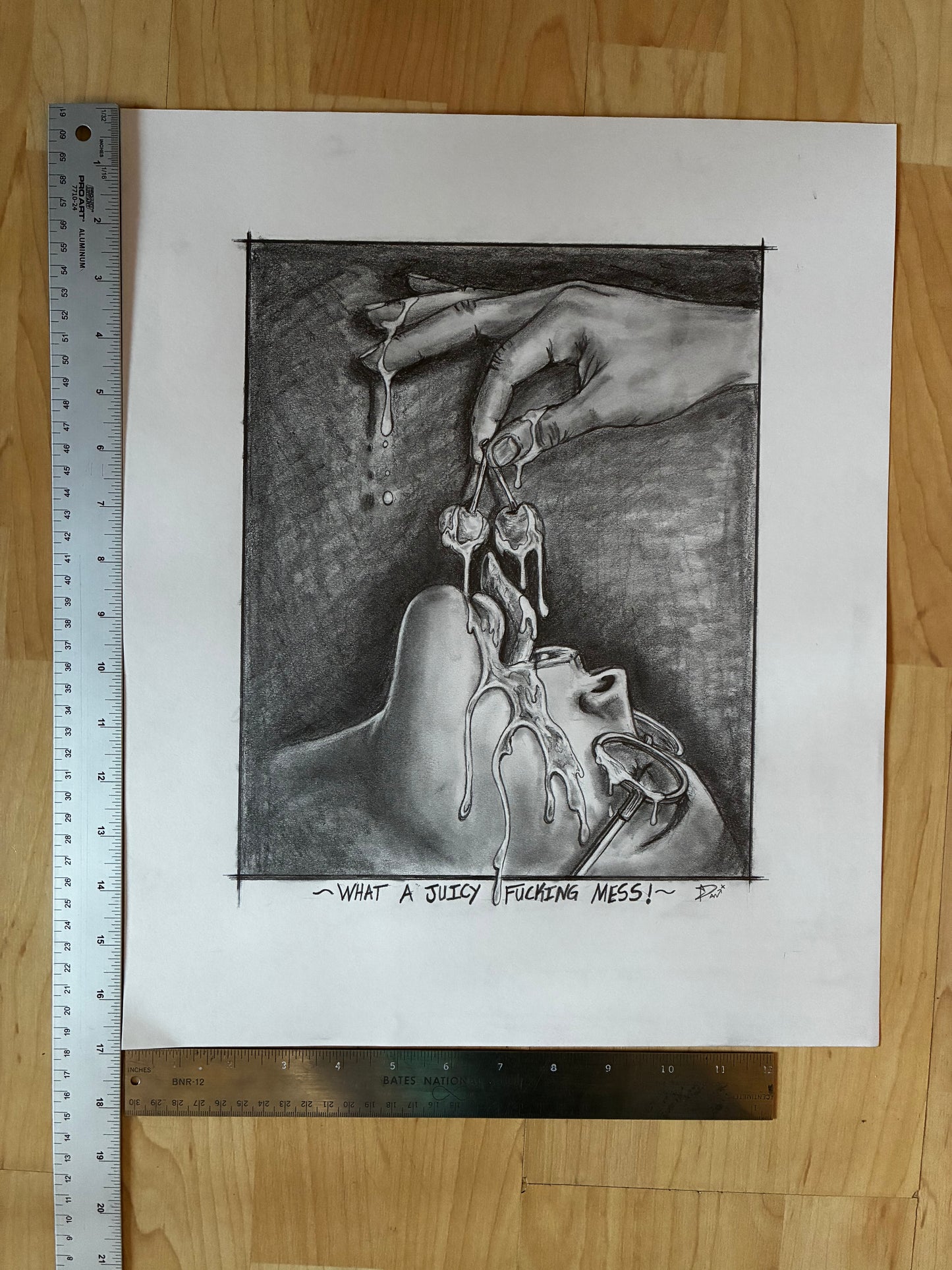 Black and white drawing of a hand holding a small object over a face, with text on a wooden surface.